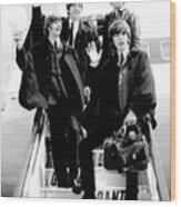 The Beatles Arriving In London Wood Print