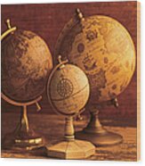 Three Globes With World Map Backdrop Wood Print