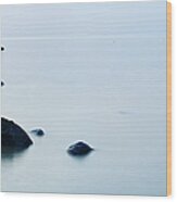 Tranquil Silver Sea With Huge Boulders Wood Print