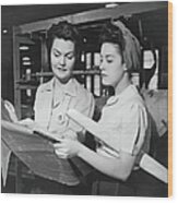 Two Women In Workshop Looking At Wood Print
