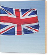 Union Jack Flag Flying In A Blue Sky Wood Print