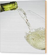 White Wine Pouring Into Glass Wood Print