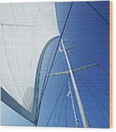 White Yacht Sail Against Blue Sky Wood Print