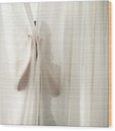 Woman Behind Curtains Wood Print