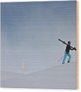 Woman Carrying Skis Walking Up Snow Wood Print