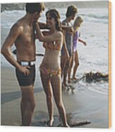 Young Couples Standing On Beach, Smiling Wood Print