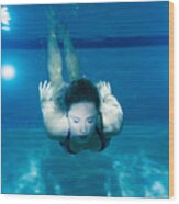 Caucasian Woman Swimming Underwater In Pool #1 Wood Print