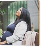 Pregnant Woman Sitting Outside #1 Wood Print