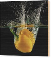 Yellow Bell Pepper Dropped And Slashing On Water Wood Print