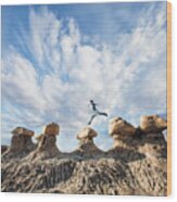 A Man Doing Parkour On Rocks In The Desert Wood Print