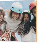 Adorable Multi-ethnic Group Of Kids Wearing Helmets And Looking To The Camera With Happiness Wood Print
