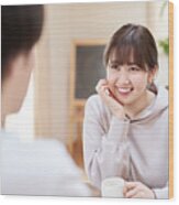 Asian Men And Women Talking With A Smile Wood Print