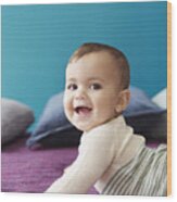 Baby Holding Himself Up And Smiling Wood Print