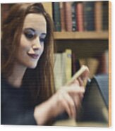 Blurred Portrait Of A Woman Busy On Her Tablet Wood Print