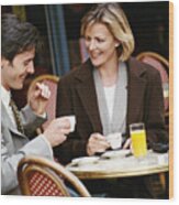 Businessman And Businesswoman Having Coffee At Cafe Terrace Wood Print