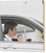 Businessman Drinking A Cup Of Coffee Sitting In His Car And Looking At A Map Wood Print