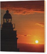 Cape Prior Silhouetted Lighthouse Against Orange Sky Sunset And Sun At The Horizon Ferrol La Corua Galicia Wood Print
