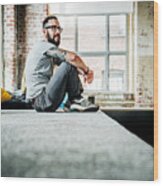 Casual Business Person Sitting In Office Loft Wood Print