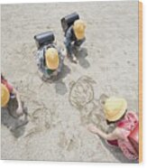 Children Drawing In The Sand Wood Print