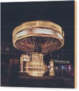 Christmas Carousel On The Streets Of Warsaw. Fire Wheel Wood Print