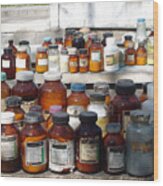 Collection Of Old Chemical Bottles In  Market Wood Print