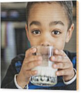 Cute African American Boy Drinking Milk At Home Wood Print