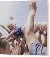Enthusiastic Woman Crowd Surfing Wood Print