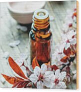 Essential Massage Oil With Flower On Rustic Wooden Background. N Wood Print