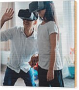 Father Using Virtual Reality Headset With His Daughter Wood Print