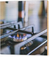 Gas Flames Burning On Kitchen Stove Top Wood Print