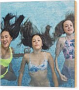 Group Of Teenage Girls In Pool Playing Mermaids. Wood Print