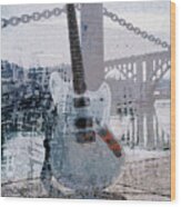 Guitar By The River Wood Print