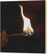 Hand With Burning Matchstick Wood Print