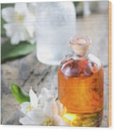 Homemade Essential Oil And Fresh Jasmine Flower Wood Print