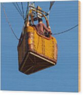 Hot Air Balloon Basket Against A Bright Blue Sky Wood Print