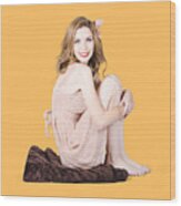 Isolated Pinup Girl Sitting On Soft Blanket Wood Print