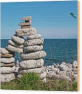Large Inukshuk By A Lake With Parasailor Wood Print