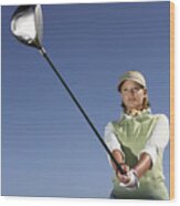 Low Angle View Of A Woman Swinging A Golf Club Wood Print