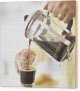 Man Pouring Coffee From Cafetiere In To Mug, Close-up, Mid Section Wood Print