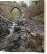 Medieval Stoned Bridge With Water Flowing In The River In Autumn. Wood Print