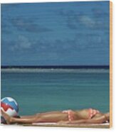 Model Lying on the Beach in a Polka Dot Bikini Wood Print