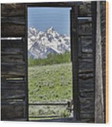 Mountains Through Cabin Window Wood Print