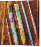 Old Paint Brushes And Worn Books Wood Print