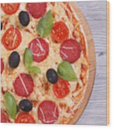 Pizza With Salami, Tomato, Cheese, Olives And Basil Close-up Wood Print