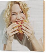 Portrait Of A Smiling, Young Woman Eating A Hamburger Wood Print