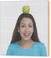 Portrait Of Woman Balancing Apple On Head Wood Print