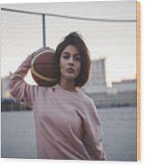 Portrait Of Young Woman Holding Basketball Outdoors Wood Print