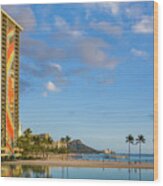 Rainbow Tower Frames The Shore In Waikiki Hawaii Wood Print