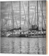 Reflections And Boats At The Harbor In Black And White Wood Print