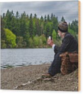 Senior Man Sitting Beside A Loch Wood Print
